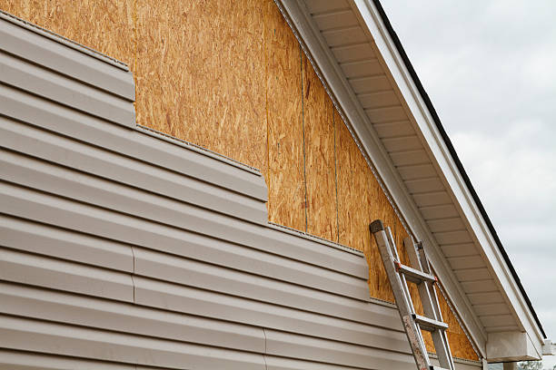 Professional Emergency Siding Repair technician working in Irwin, OH